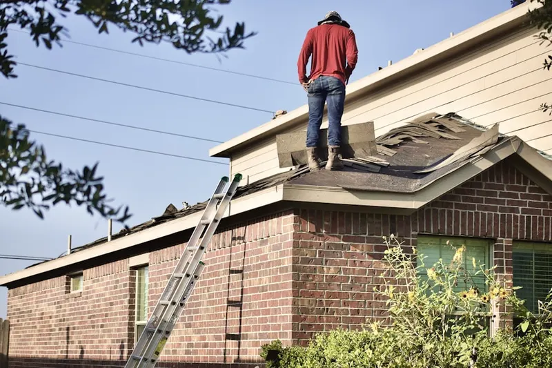 Professional roofer working on a residential roof in Scuffleburg
